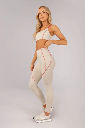 Calça Legging com Bolso e Vivo nas Laterais (Bege / Rosa Pink)